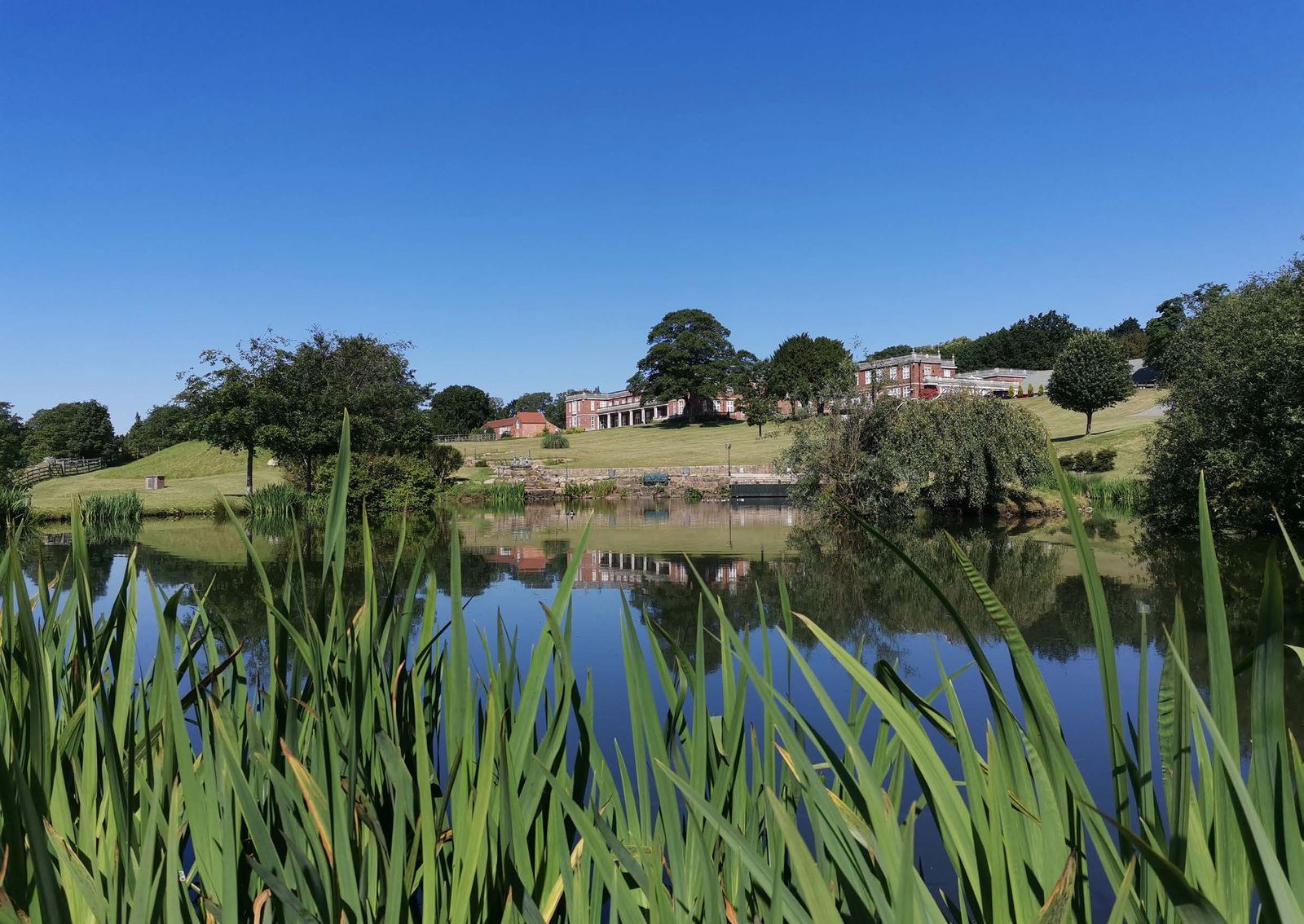 Hopwell Hall seen across its lake