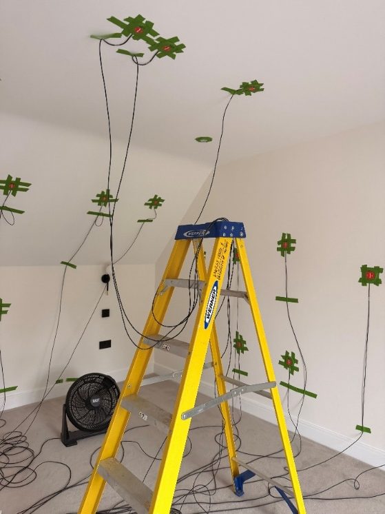 Sensors and monitoring equipment fixed to the walls and ceiling during testing