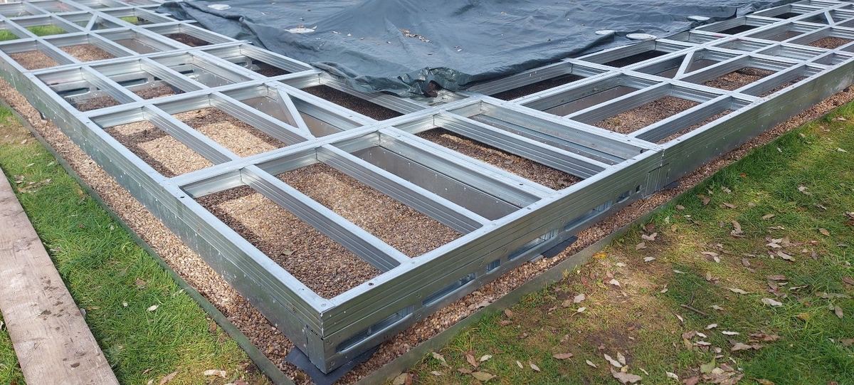 The floor frame sitting on screw piles