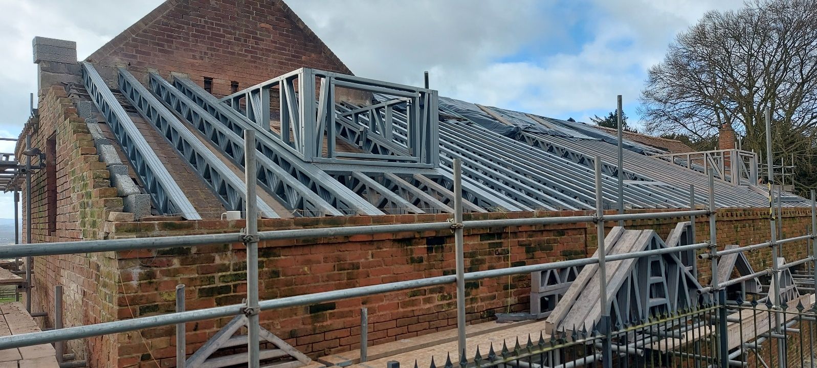 Steel rafters being installed on the fire-damaged building