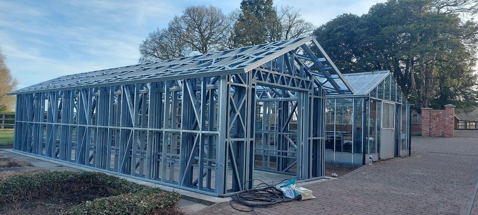 The long roof frame of the replacement store, a continuous 13-metre span