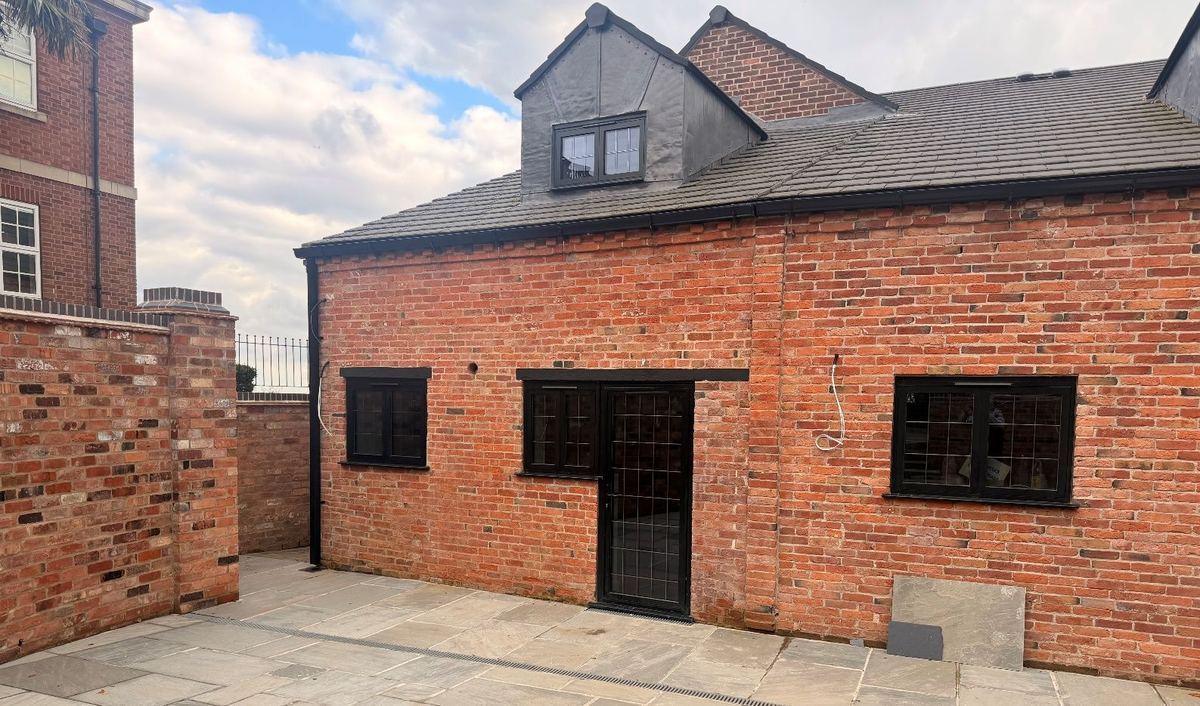 The original brick exterior preserved around the new structure